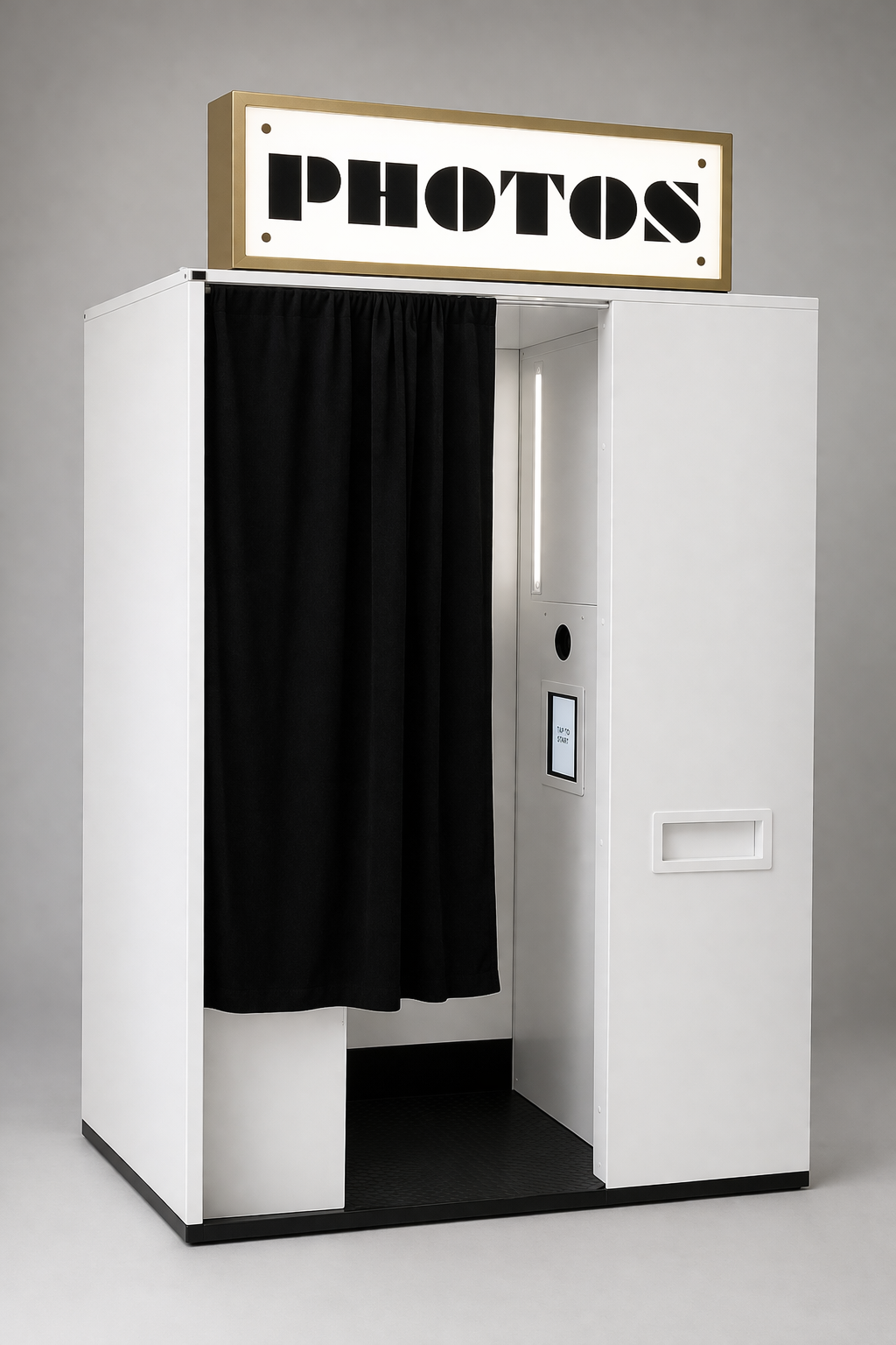 Guest seated inside Youtopia’s enclosed photo booth for a private, studio-quality portrait experience